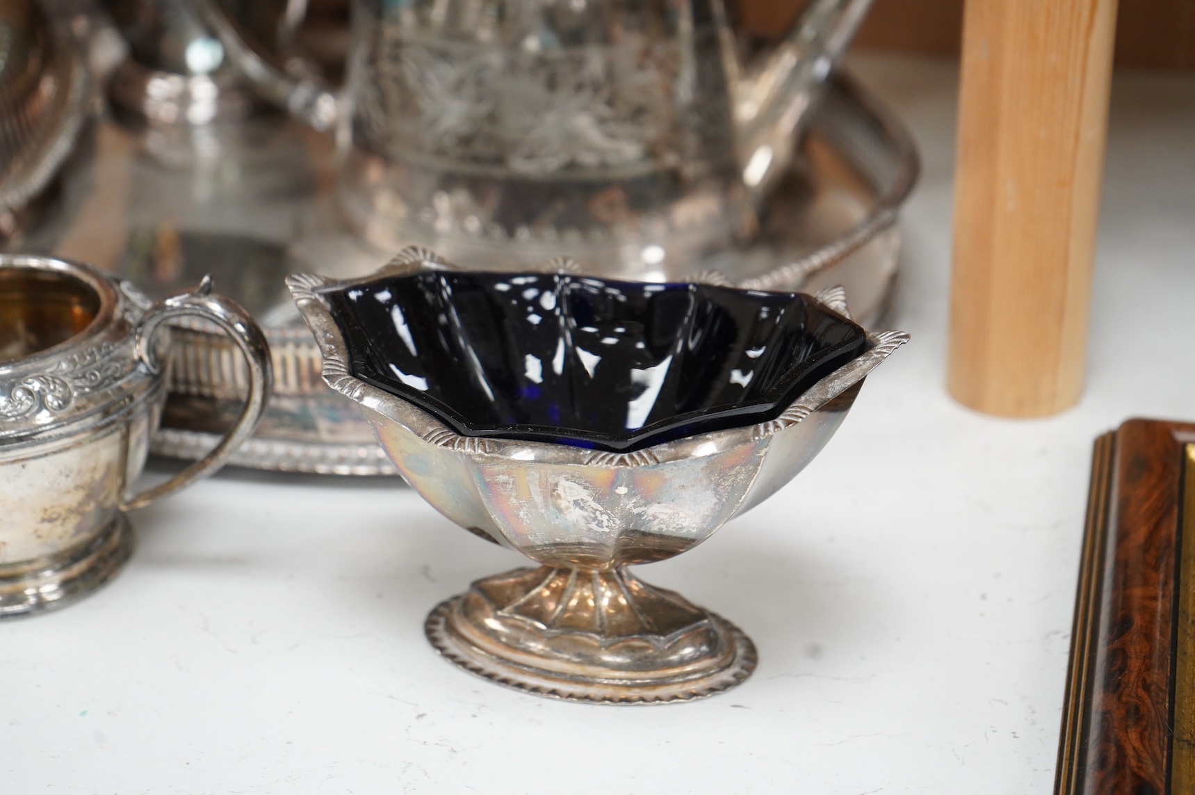 A quantity of plated wares to include a galleried tray, teapot, jug and bon bon dish with glass liner, largest 45cm wide